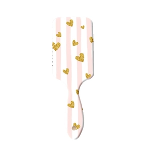 Brosse à cheveux rose et blanche à rayures avec motifs de cœurs dorés brillants