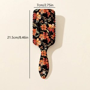 Vintage floral air cushion hairbrush with orange flower pattern and rectangular massage base