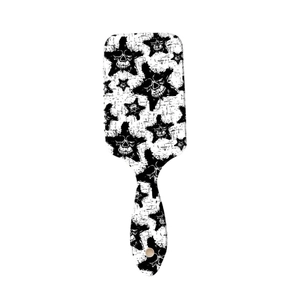 Star and skull print hair paddle brush with black and white massage bristles
