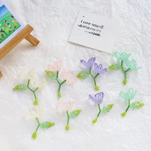 Detailed view of handmade woven crystal pearl bead flowers for DIY jewelry making
