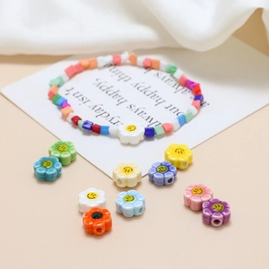 Detail of colorful smiley face ceramic flower beads for DIY jewelry making