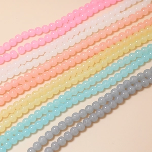 Detail of 8mm macaron frosted glass beads for DIY jewelry making in various pastel colors
