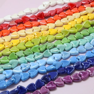 Rainbow variety of heart-shaped glazed ceramic beads for DIY jewelry making and crafts