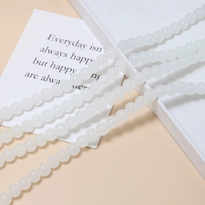 Macro shot of 8mm translucent white round jelly beads for DIY handmade jewelry crafts