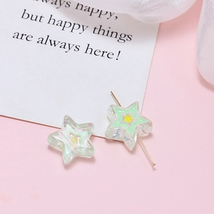 Detailed view of pentagram acrylic star beads with green inner core for DIY jewelry making