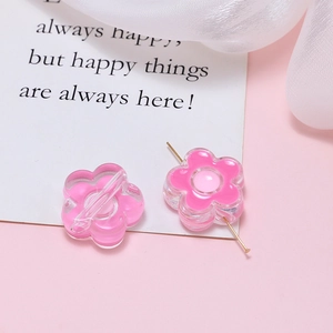 Detail showing acrylic flower beads for DIY jewelry making with clear pink finish