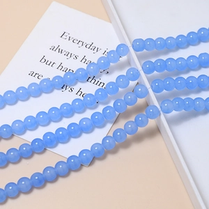 Close-up of sky blue 8mm macaron glass beads for DIY jewelry making and crafts