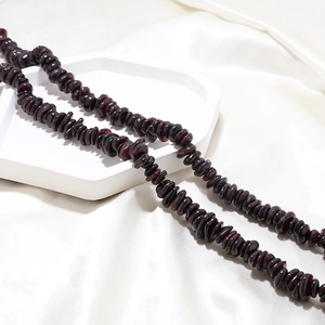 Close-up of deep red natural garnet irregular stone beads for DIY jewelry making