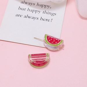 Detailed close-up of handmade acrylic watermelon earrings with vibrant resin layers