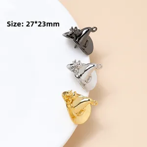 Macro shot of 27x23mm gold and silver witch hat pendants for DIY jewelry making