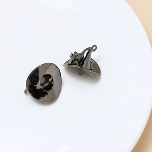 Detailed view of gun-black metal witch hat pendants with smooth polished finish