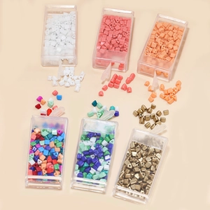 Assorted 4mm geometric glass seed beads in storage boxes for DIY jewelry making