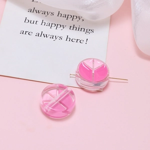 Macro shot of two transparent pink resin beads for DIY jewelry with unique Y-shaped core