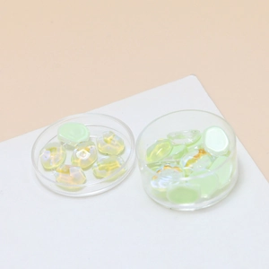 Macro detail of iridescent jelly color water ripple crystal glass beads for DIY nail art
