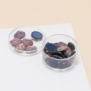 Close-up of iridescent jelly purple flatback crystals for DIY jewelry and nail art