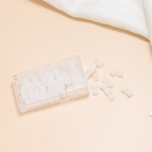 Detail of 4mm frosted white square glass beads and clear storage box for DIY jewelry