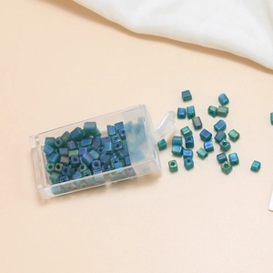 Macro shot of 4mm iridescent square glass beads for DIY bracelet and jewelry making