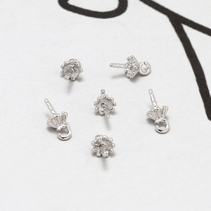 Detailoverzicht van verzilverde parelkapjes voor DIY sieraden maken accessoires