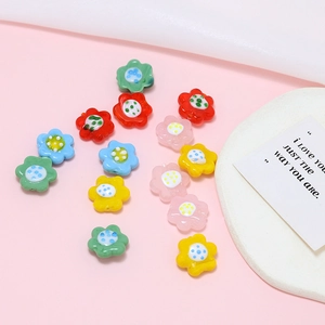 Close-up of colorful flower-shaped glass beads for DIY jewelry making accessories