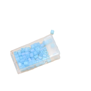 Light blue frosted 4mm square glass beads for DIY jewelry making in a plastic storage box