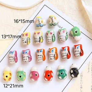 Detailed size comparison of colorful owl-shaped ceramic beads for DIY jewelry making