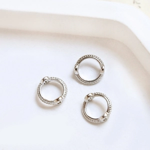 Detailed close-up of textured gold-plated brass double-hole beaded ring components