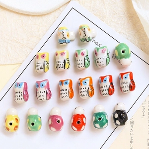 Colorful ceramic animal beads with owl and ladybug designs for DIY jewelry making
