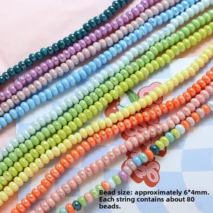 Detail of 6x4mm macaron ceramic beads for DIY jewelry making showing 80 beads per strand