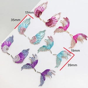 Macro detail of colorful enamel feather wing charms with dimensions for jewelry making