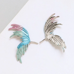 Detail showing gold-plated feather wing charms with colorful gradient enamel and silver finish