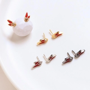 Detailed wing earrings with red enamel inlay in gold, silver, and gunmetal finishes