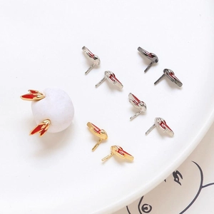 Detailed view of multi-color flame-shaped DIY earrings set in gold and silver finish