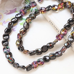 Macro shot of colorful iridescent glass square beads for DIY jewelry making