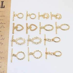 Divers fermoirs à bascule OT dorés motifs fleurs et cœurs pour la création de bijoux