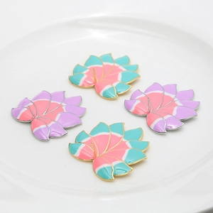 Macro detail of four enamel lotus petal pendants with gold and silver plated metal edges