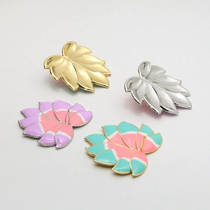 Gold-plated leaf jewelry accessories with colorful enamel and brushed metal finishes