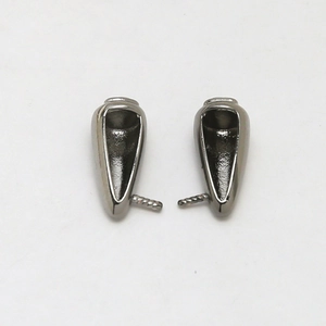 Macro detail of gunmetal grey pearl peg bails with anti-slip needles for jewelry making