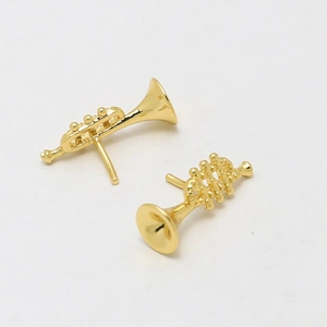 Macro shot of 18k gold-plated trumpet earrings for DIY creative jewelry design