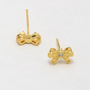Front and back view of gold-plated bow earrings with center-set clear zircon detail