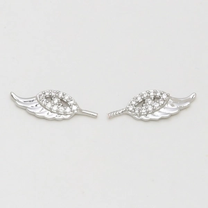 Macro detail of silver wings accessories featuring clear zircon pavé stones and fine textures
