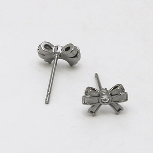 Detail of dark grey bow stud earrings with center crystal for DIY jewelry making