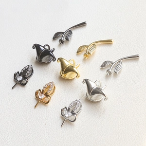 Baroque style gold and silver plated copper pendants with leaves and floral bud designs