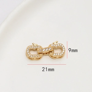 Détail des connecteurs pommes 21x9mm en cuivre doré avec micro-pavage en zircone