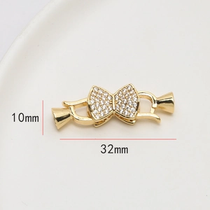 Détail du connecteur noeud doré 18 carats avec oxydes de zirconium (32x10mm)
