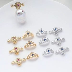 Detailed view of gold-plated crown pendants with zircon inlay and baroque style accents