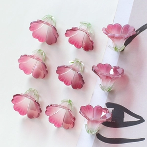Detail showing semi-transparent pink gradient trumpet flower beads for DIY hair ornaments