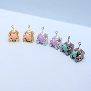 Astronaut charms for jewelry making with colorful star motifs in gold and silver plating