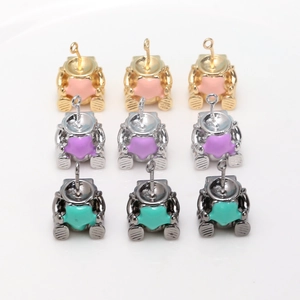 Detailed grid of gold silver and black astronaut pendants with colorful enamel stars