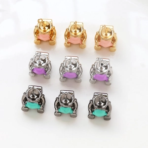 DIY astronaut pendants in gold silver and grey finishes for handmade jewelry making