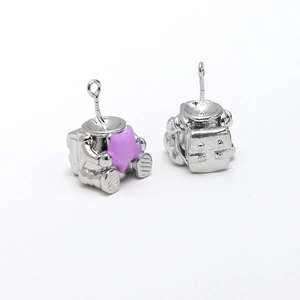 Detail of S925 sterling silver astronaut charm with purple star and intricate gear patterns